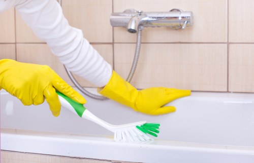 Cleaner using PPE while working in a home setting